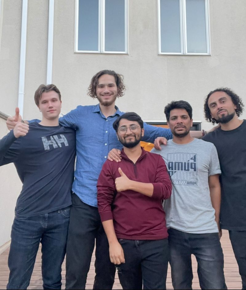 Tristan Gross celebrating with the TRIZAN team on a rooftop