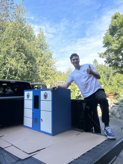 Tristan Gross with a TRIZAN smart locker unit loaded for delivery